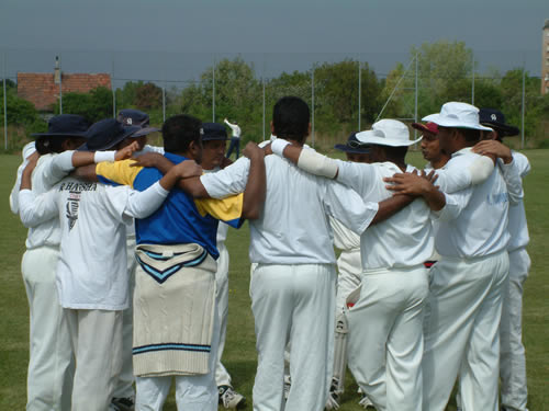 Sri Lankan CC have a team talk before their game against Pak Falken CC