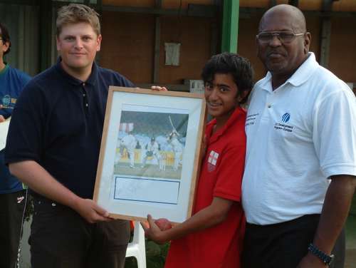 Michael Bailey and Siva Nadarajah present a special award to Rohan Dickinson